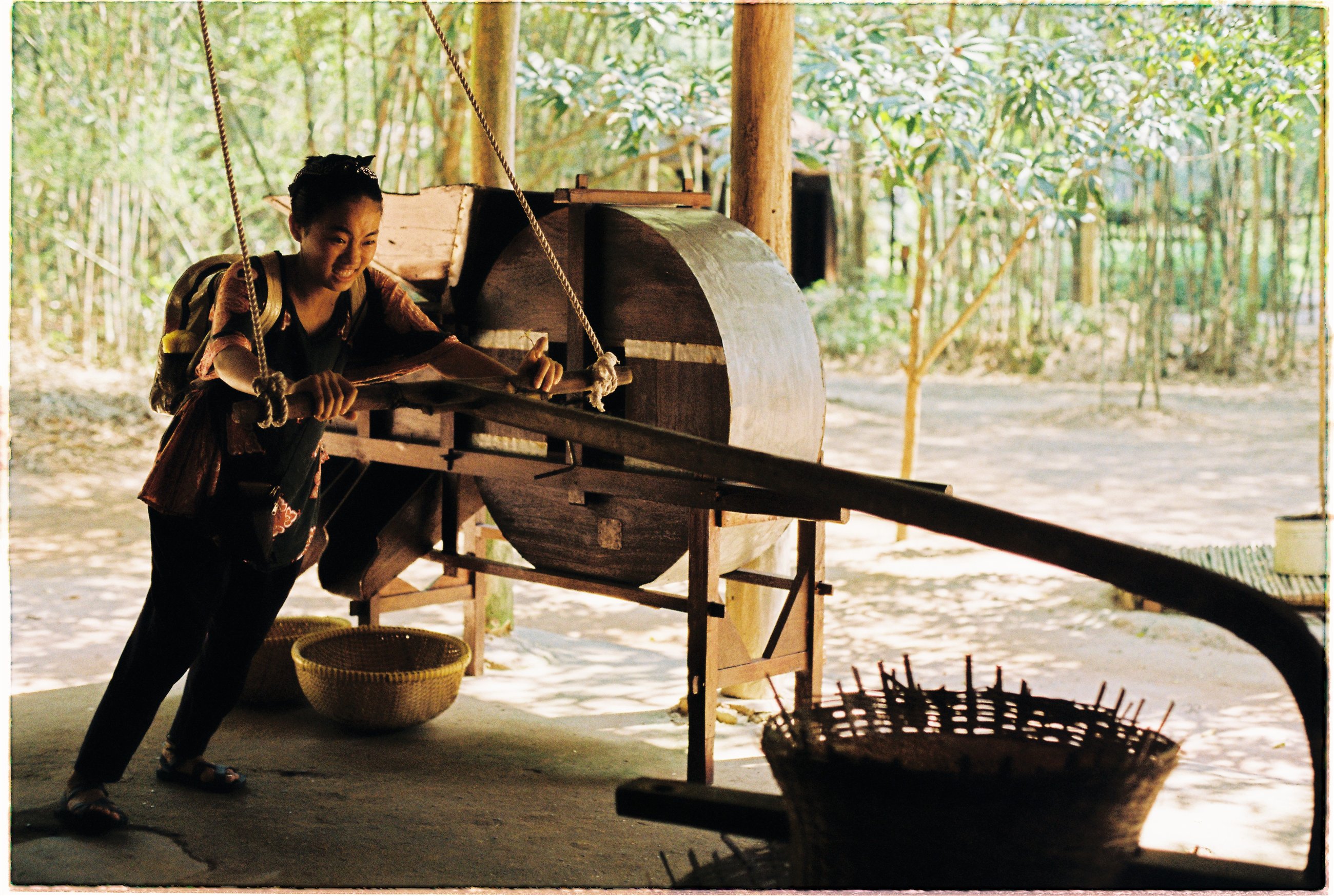 A wooden press photographed on an Olympus OM-2n film roll.